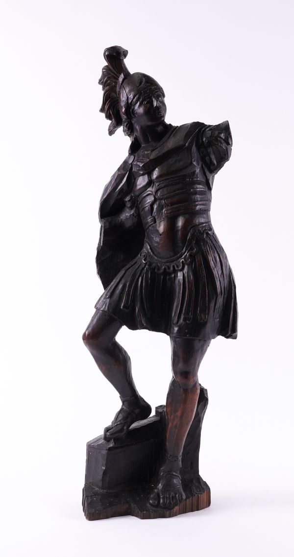 A NORTH EUROPEAN CARVED OAK FIGURE OF A ROMAN CENTURION