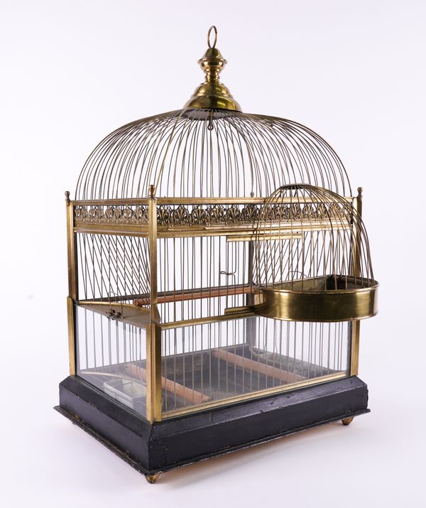 AN ENGLISH BRASS BIRD CAGE WITH DOME TOP