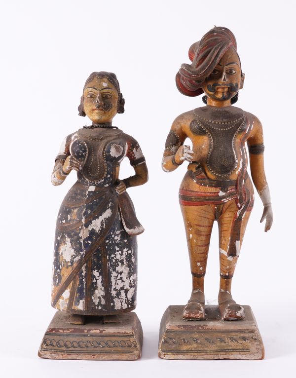 A PAIR OF INDIAN POLYCHROME DECORATED STANDING FIGURES (2)