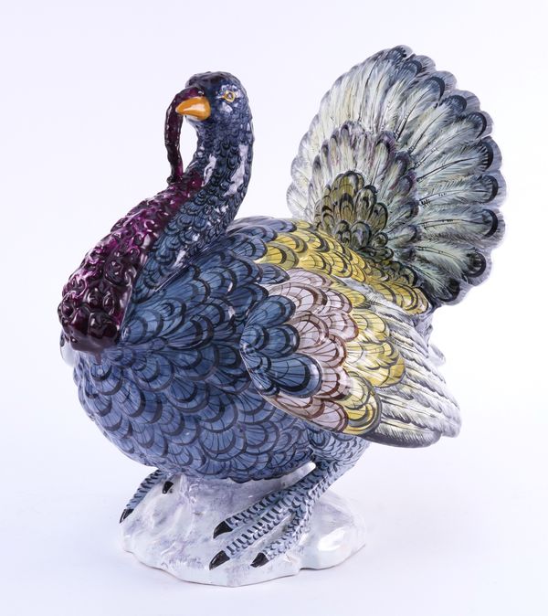 A LARGE FRENCH FAIENCE TIN GLAZED MODEL OF A TURKEY IN THE MANNER OF PAUL HANNONG