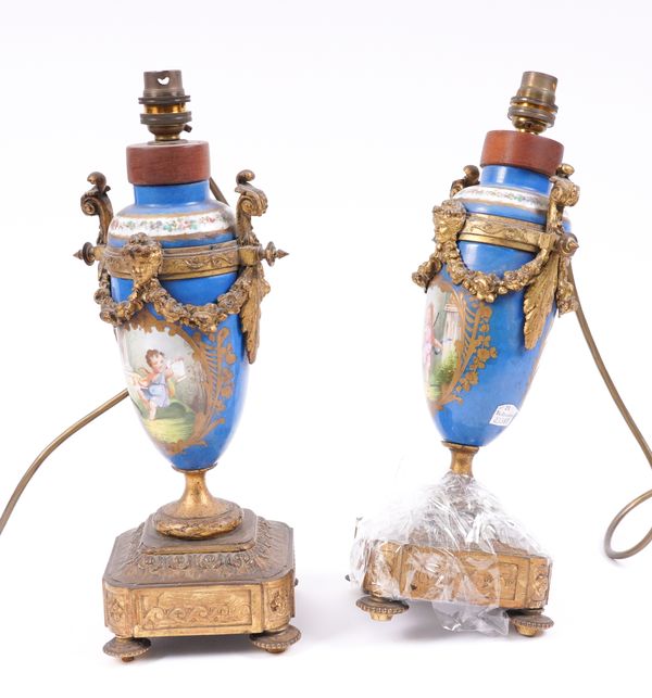 A PAIR OF FRENCH GILT-METAL MOUNTED SEVRES STYLE PORCELAIN URN TABLE LAMPS (2)