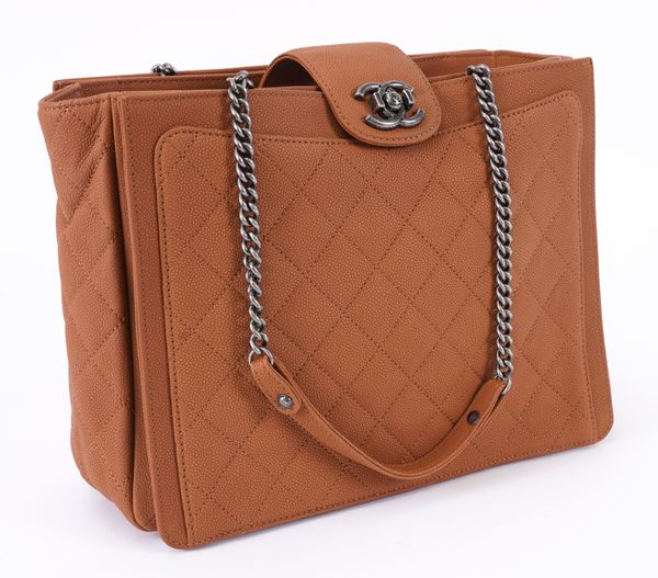 CHANEL: A QUILTED TAN SHOPPING BAG