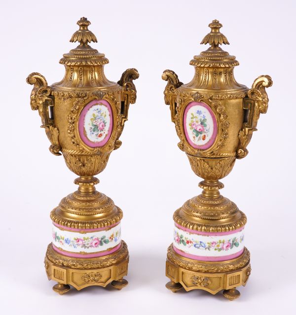 A PAIR OF FRENCH LOUIS XVI STYLE GILT-METAL AND PARIS PORCELAIN MOUNTED ORNAMENTAL URNS (2)