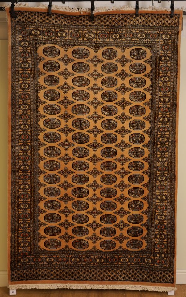 A PAKISTAN BOKHARA AND A TURKISH MODERN YACABADIR RUG (2)