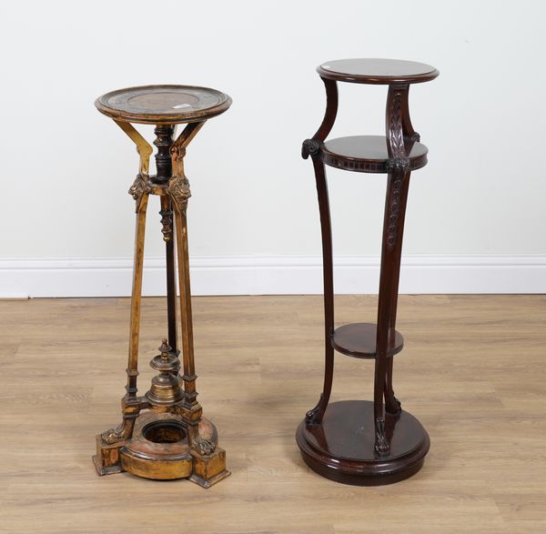 AN 18TH CENTURY STYLE GILT CIRCULAR TORCHERE STAND WITH GROTESQUE MASKS AND PAW FEET (2)