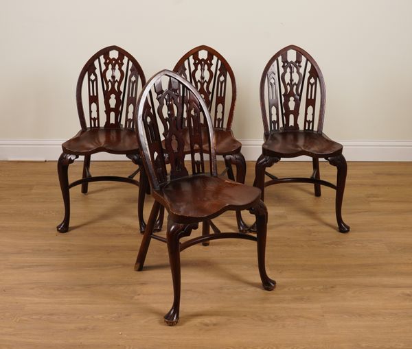 A SET OF FOUR 20TH CENTURY ELM SEATED GOTHIC BACK WINDSOR CHAIRS WITH CRINOLINE STRETCHERS (4)