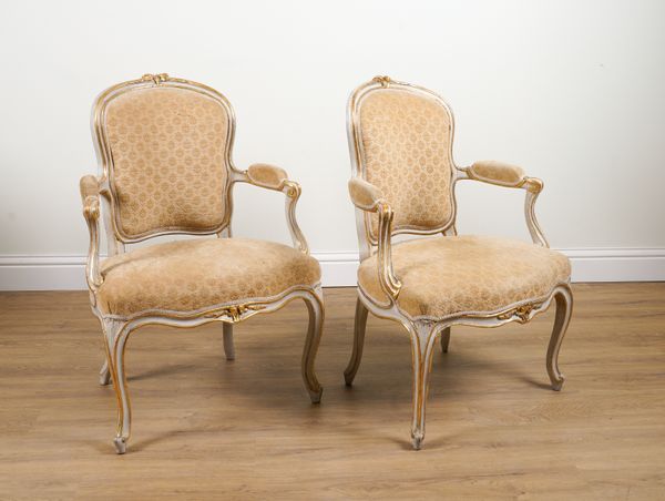 JEAN-BAPTISTE BOULARD (1725-1789); AN 18TH CENTURY FRENCH PARCEL GILT CREAM PAINTED OPEN ARMCHAIR ON CABRIOLE SUPPORTS (2)