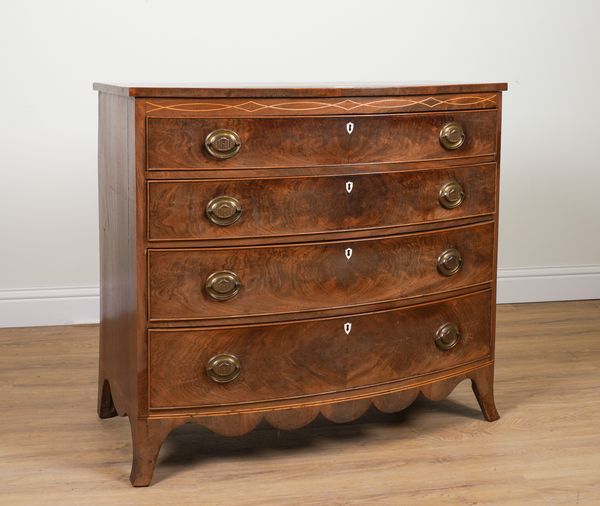 A REGENCY MAHOGANY BOWFRONT FOUR DRAWER CHEST OF DRAWERS ON SPLAYED BRACKET FEET