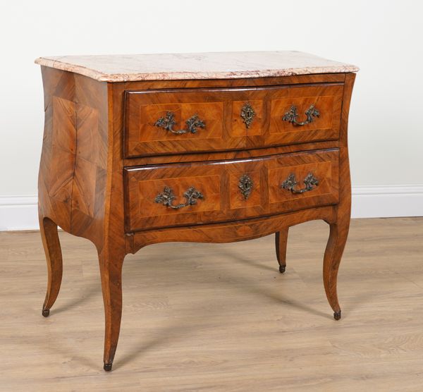 AN EARLY 19TH CENTURY FRENCH SERPENTINE MARBLE TOPPED INLAID WALNUT TWO DRAWER COMMODE