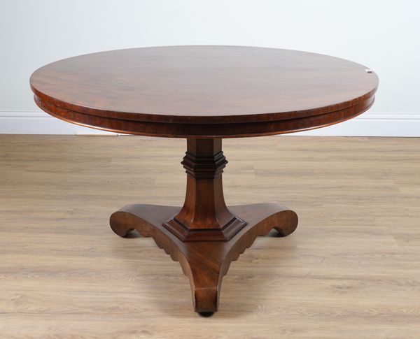 A REGENCY CIRCULAR MAHOGANY SNAP TOP CENTRE TABLE ON TREFOIL PLATFORM