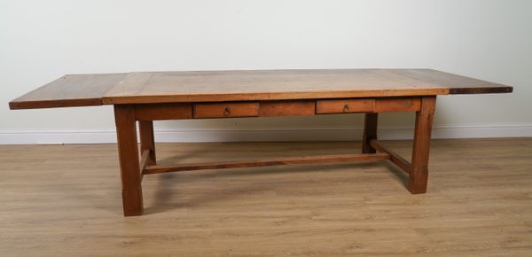 AN EARLY 19TH CENTURY FRENCH STYLE HARDWOOD EXTENDING KITCHEN TABLE