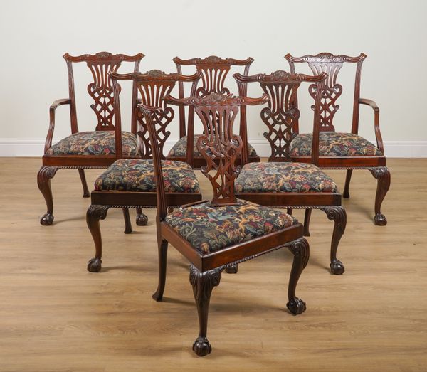 A SET OF SIX GEORGE III MAHOGANY PIERCED SPLAT BACK DINING CHAIRS ON CLAW AND BALL FEET (6)