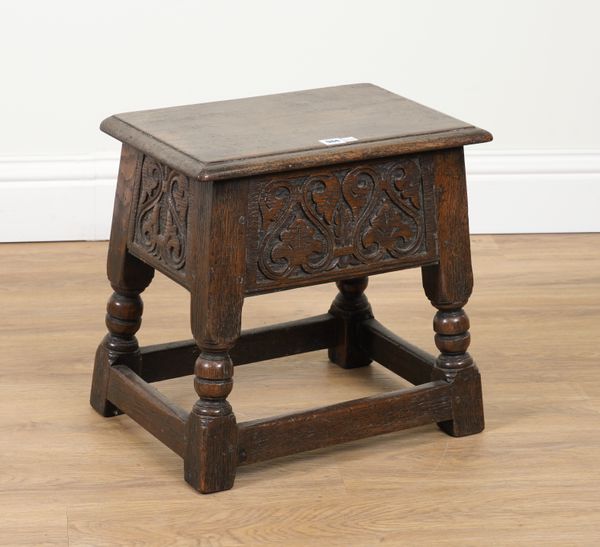 A 17TH CENTURY STYLE CARVED OAK BOX SEAT JOINT STOOL