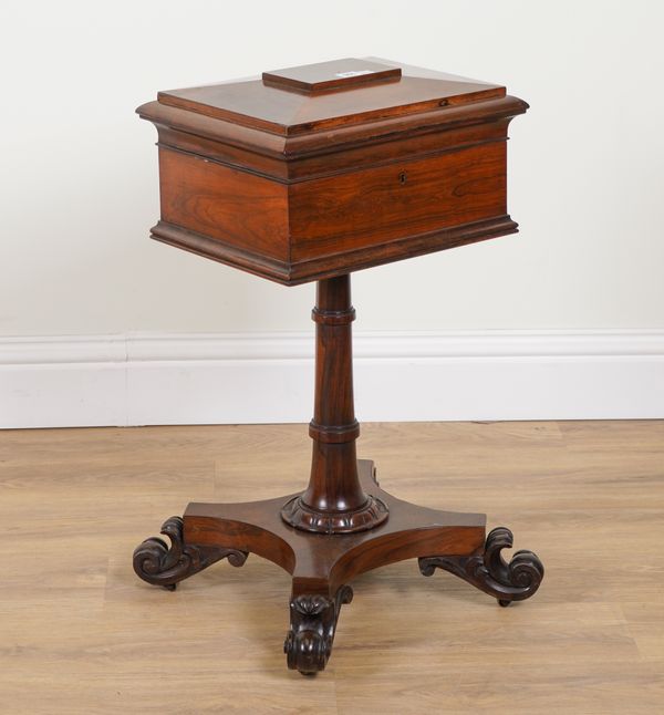 A REGENCY ROSEWOOD SARCOPHAGUS FORM TEAPOY ON SCROLL QUATREFOIL PLATFORM