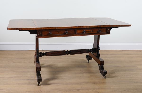 A REGENCY ROSEWOOD TWO DRAWER SOFA TABLE ON FOUR DOWNSWEPT SUPPORTS