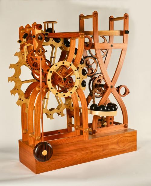 AN IMPRESSIVE WOODEN SKELETON TIMEPIECE