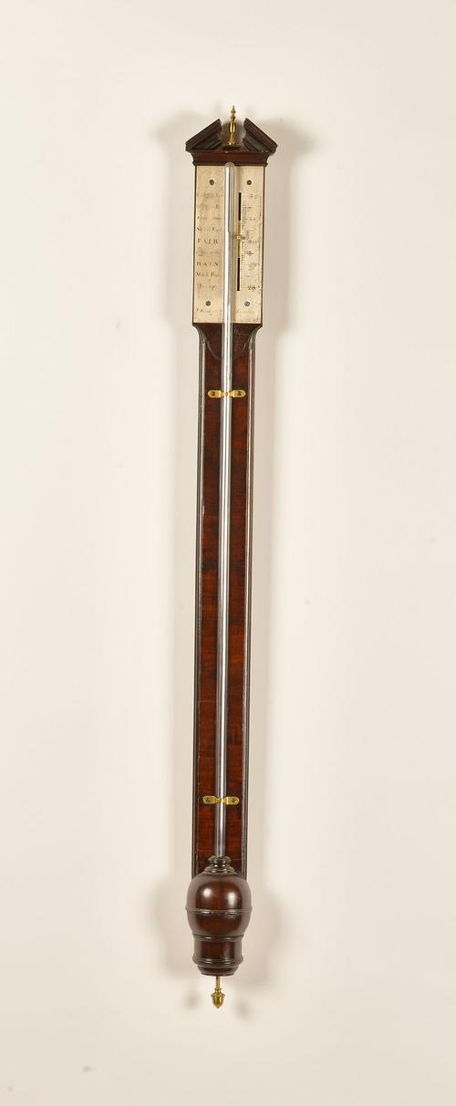 AN EARLY GEORGE III MAHOGANY STICK BAROMETER