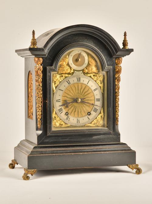 A LATE VICTORIAN ORMOLU-MOUNTED EBONISED QUARTER STRIKING MANTEL CLOCK