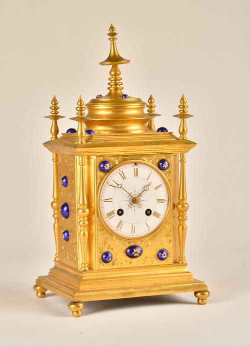 A FRENCH ORMOLU AND BLUE ENAMEL DECORATED MANTEL CLOCK