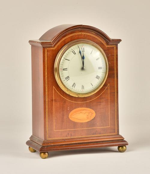 AN EDWARDIAN MAHOGANY AND INLAID MANTEL TIMEPIECE