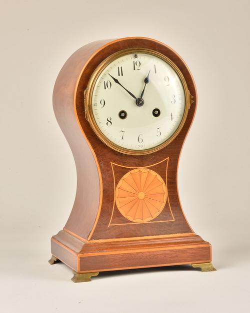 AN EDWARDIAN MAHOGANY AND INLAID MAHOGANY BALLOON MANTEL CLOCK