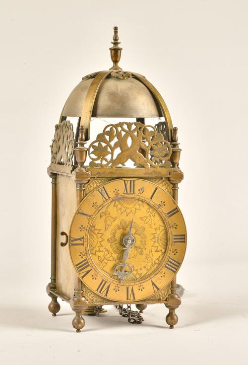 A BRASS STRIKING LANTERN CLOCK