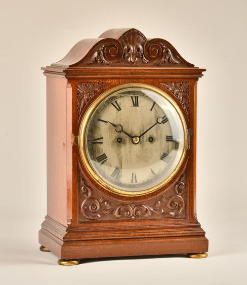 AN EDWARDIAN MAHOGANY BRACKET CLOCK