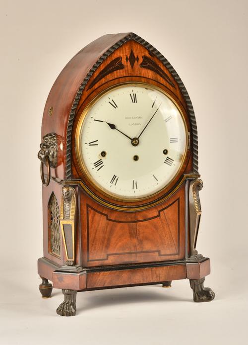 A RARE REGENCY PARCEL-GILT BRONZE-MOUNTED MAHOGANY AND LINE INLAID LANCET-SHAPED QUARTER STRIKING BRACKET CLOCK