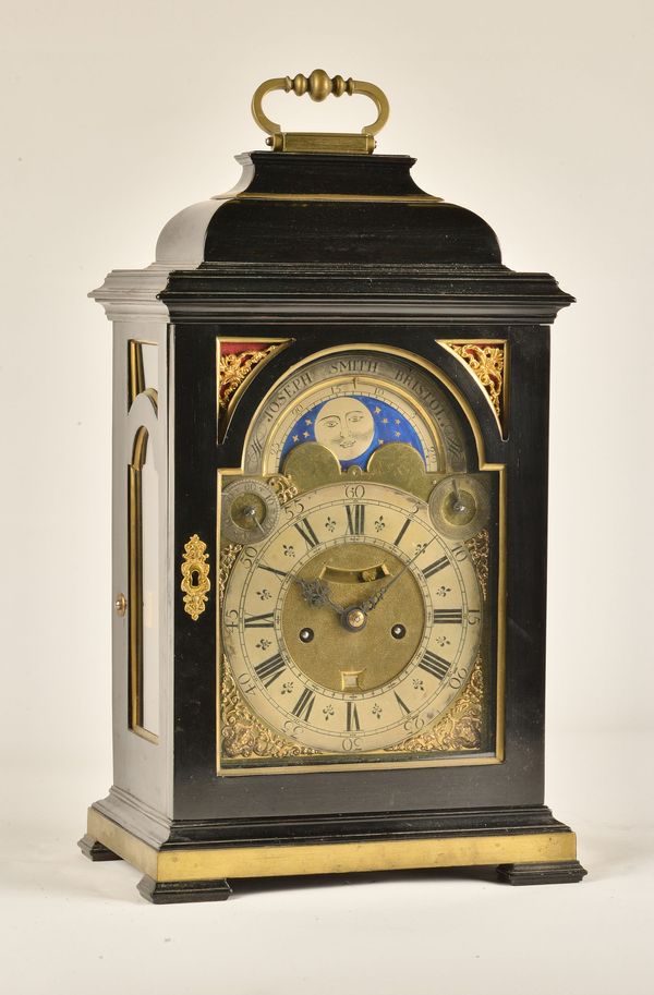 A GEORGE II BRASS-MOUNTED EBONISED QUARTER REPEATING STRIKING TABLE CLOCK WITH MOON PHASE