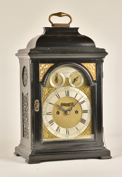 A GEORGE II EBONISED STRIKING AND REPEATING BRACKET CLOCK
