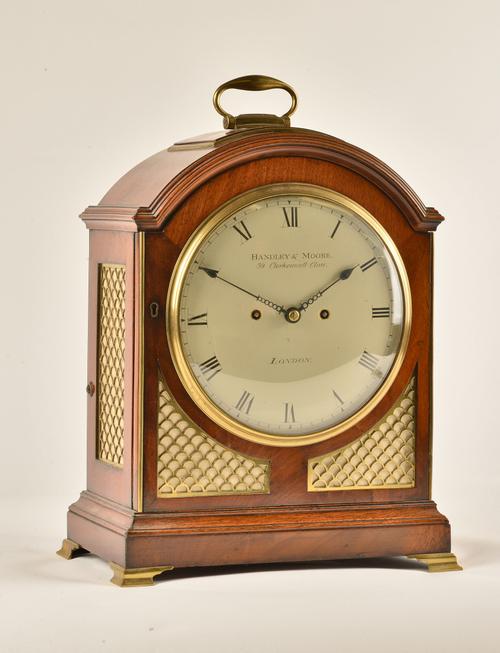 A GEORGE III MAHOGANY BRASS MOUNTED STRIKING BRACKET CLOCK