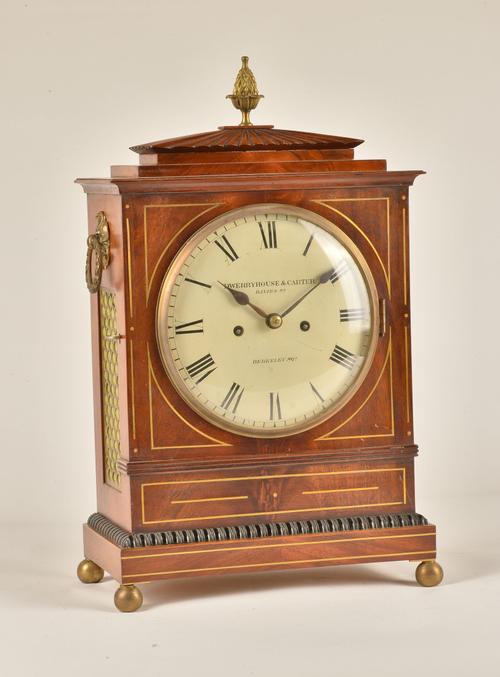 A REGENCY MAHOGANY AND BRASS LINE INLAID STRIKING BRACKET CLOCK