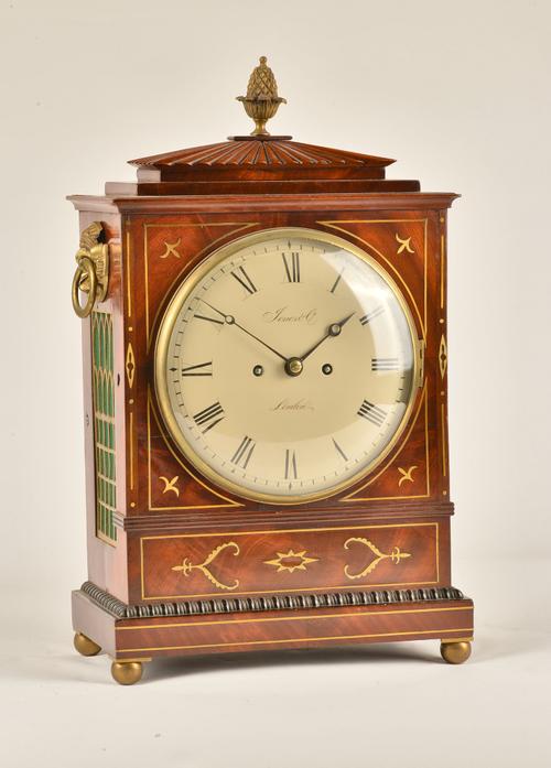 A REGENCY BRASS-INLAID MAHOGANY STRIKING BRACKET CLOCK