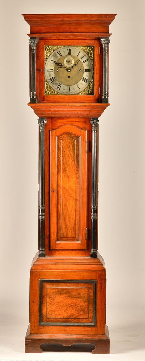 A LATE VICTORIAN WALNUT AND EBONISED TUBULAR QUARTER CHIMING LONGCASE CLOCK