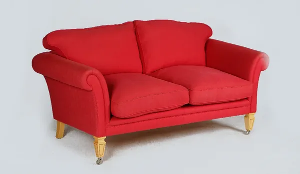 LINLEY; A DEEP SALMON TWO-SEAT SOFA