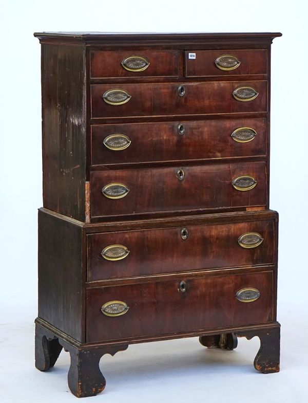 A small walnut chest on chest