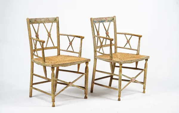 A pair of cream-painted rush seat armchairs