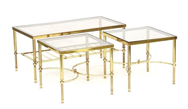 A set of three lacquered brass and glass occasional tables