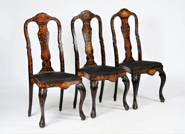 A set of three Dutch mahogany and marquetry inlaid side chairs