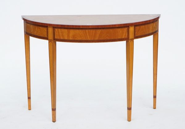 An Edwardian mahogany banded satinwood semi-elliptical console