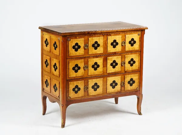 A Transitional style walnut three drawer commode