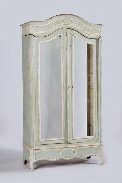 A cream and green painted armoire