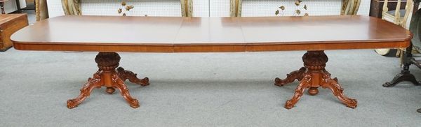 An 18th century Italian style mahogany extending dining table