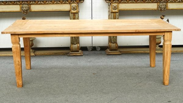 A teak plank top kitchen table