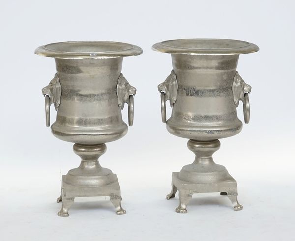 A pair of large silver painted baluster urns