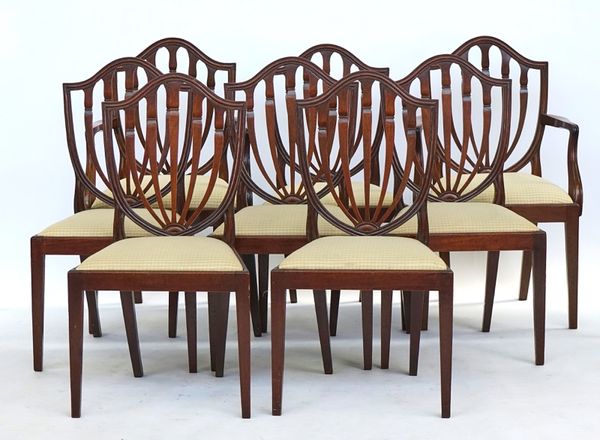 A set of eight Hepplewhite style mahogany shield back dining chairs