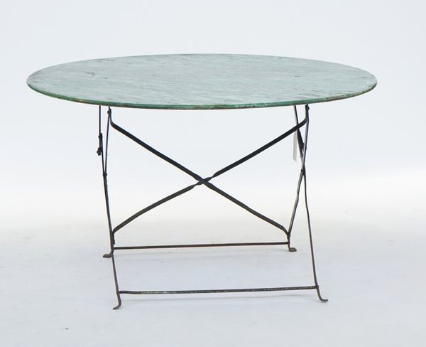 A circular metal garden table