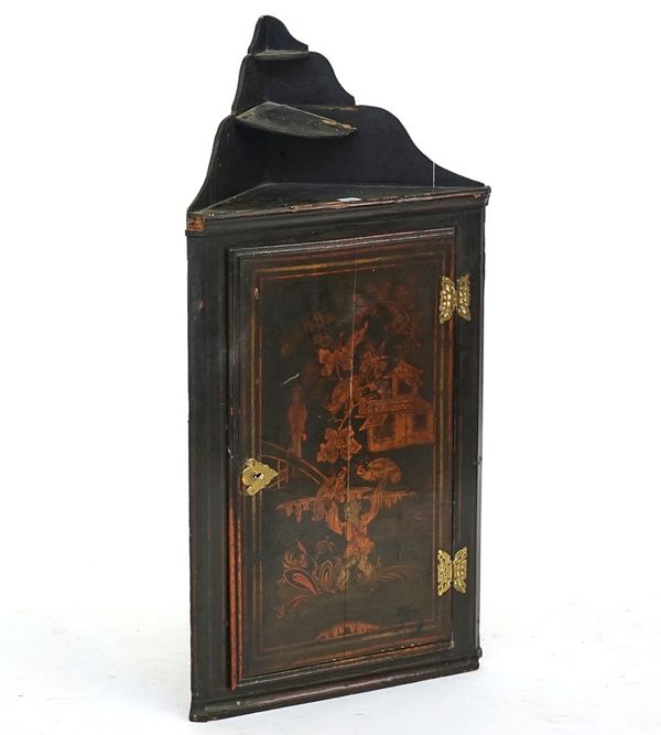 A black lacquer chinoiserie decorated hanging corner cupboard