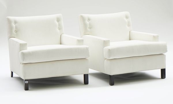 A pair of square back easy armchairs