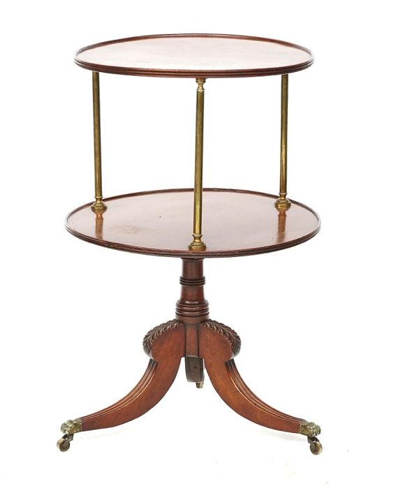 A George III mahogany and brass circular two tier dumb waiter